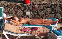Kelly Brook sunbathing topless