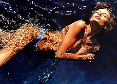 Bridget Hall topless in a water
