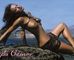 Magda Gomes sitting topless in nature