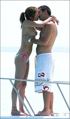 English model Sophie Anderton topless kissing on a yacht paparazzi photo
