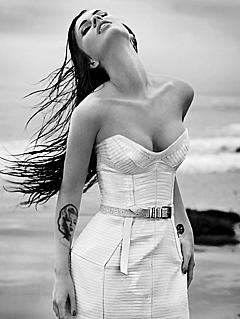 Megan Fox posing in white dress