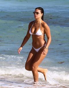 Brooks Nader in white bikini on the beach in Miami