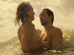 Loes Haverkort topless in the ocean at De Eetclub