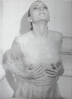 French singer and actress Patricia Kaas in wet see through dress