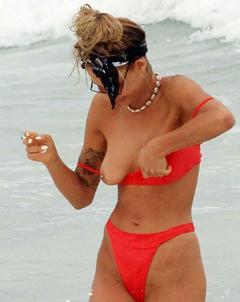 Sahara Ray tit slip in red bikini
