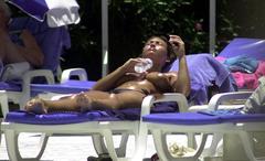 Lucinda Rhodes-Flaherty sunbathing topless paparazzi photo