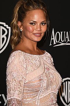 Chrissy Teigen in see through dress at InStyle and Warner Bros Golden Globes Party in Beverly Hills