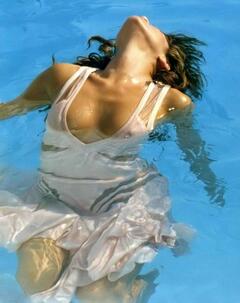 Eva Mendes in wet see trhough dress in a pool