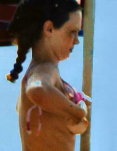 Beatrice Luzzi topless on a beach paparazzi image