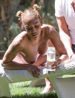 Melanie Brown sunbathing topless