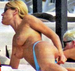 Raffaella Zardo sunbathing topless