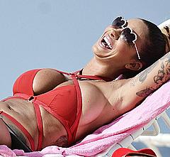 Busty Jodie Marsh sunbathing in red bikini in Barbados