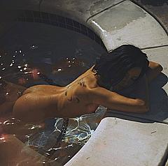 Nicole Branch naked in a water
