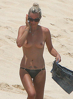 Laeticia Hallyday caught topless on the beach