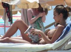 Spanish actress, singer, and model Natalia Sanchez sunbathing topless