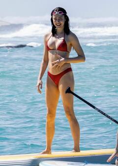 Margaret Qualley in red bikini on the beach in Hawaii - November 03, 2025