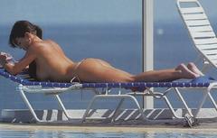 Pamela David sunbathing topless