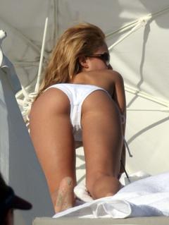 Jessica Alba shows ass in white bikini