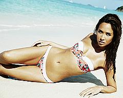 Myleene Klass lying in bikini on a beach