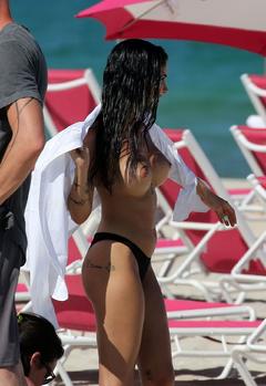 Giulia De Lellis topless on a beach in Miami