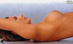 Martina Colombari lying topless