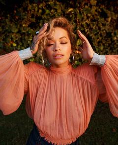 Rita Ora braless in see through blouse