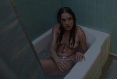 Dana Drori nude in a bathtub at Into the Dark