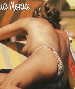 Carolina Morace topless on a beach paparazzi photo