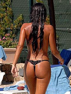 Alessia Merz braless on a beach