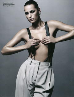 Yasmin Le Bon topless but covered