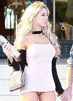 Daisy Lea in pink dress upskirt shows her nude pussy