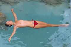 Laeticia Hallyday topless in a water