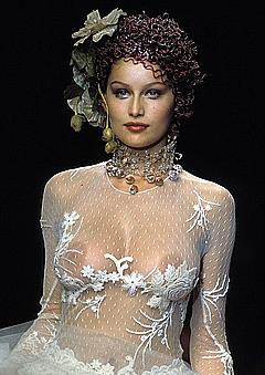 French actress and model Laetitia Casta nude boobs under see through dress runway photo