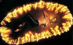 Lene Nystrom lying topless covere her tits