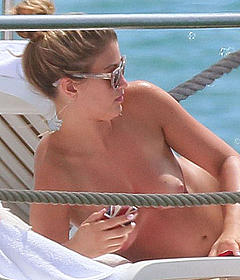 Amy Willerton sunbathing topless in Cannes