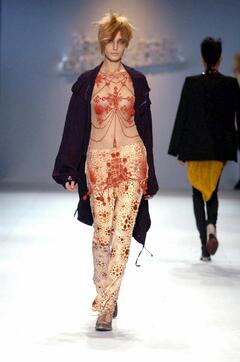 Eugenia Volodina in see through top walks runway at Jean Paul Gaultier