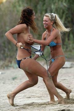 Natalie Denning topless on a beach with friends