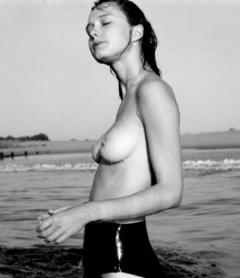 Judith Leclerc topless in a water