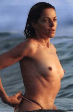 Claudia Gerini topless in a water paparazzi photo