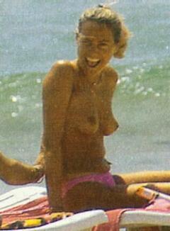Federica Panicucci topless on a beach paparazzi photo
