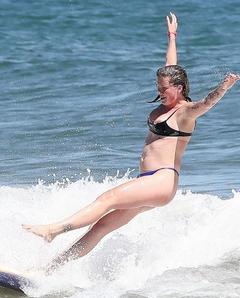 Ireland Baldwin paddleboarding in Miami