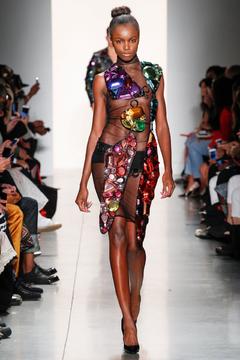 Leomie Anderson in see trhough dress runway image