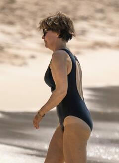 Emma Forbes in black swimsuit on the beach at Sandy Lane Hotel during a winter break in Barbados