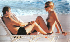 Sharon Stone topless on a beach paparazzi photo