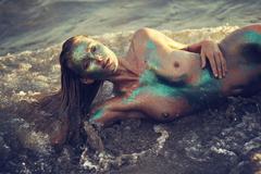 Elsa Hosk lying topless bodypainted