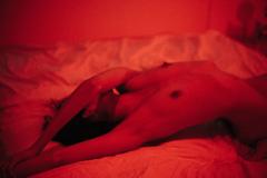 Nohemi Del Bosque lying nude on a bed