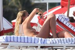 Toni Garrn topless on a beach paparazzi photo