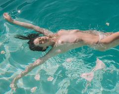 Beate Muska topless in a water