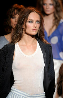 Karmen Pedaru walks runway in see through top