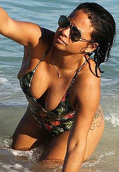 Christina Milian in bathing suit on a beach in Miami